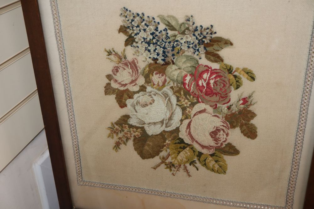A petit point fire screen and a silkwork floral embroidered firescreen